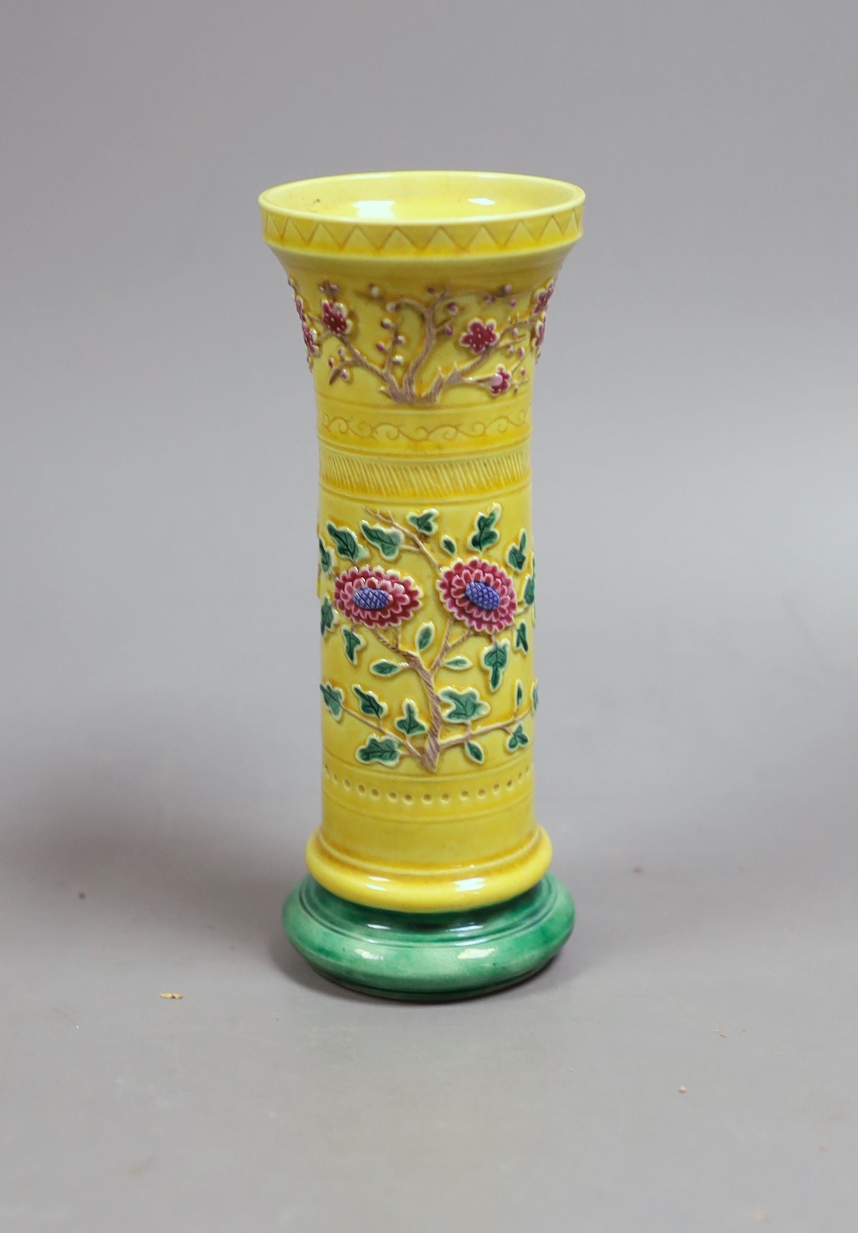 A 19th century Chinese (Qing) yellow background vase, 15 cms high.